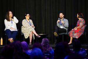 Panel of four presenters in discussion