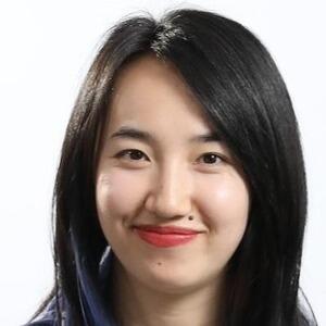 Headshot of Dr Debbie Pu. She has dark, shoulder length hair and is smiling at the camera.
